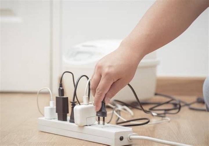 Does leaving an extension cord plugged in use electricity?