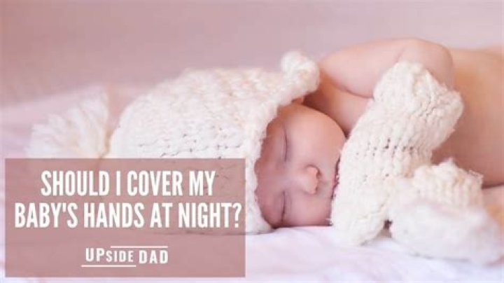 Should I cover my baby's hands at night?