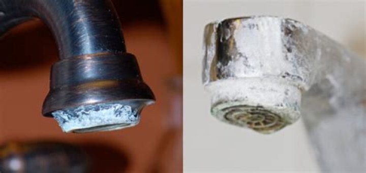 What causes white buildup on faucets?