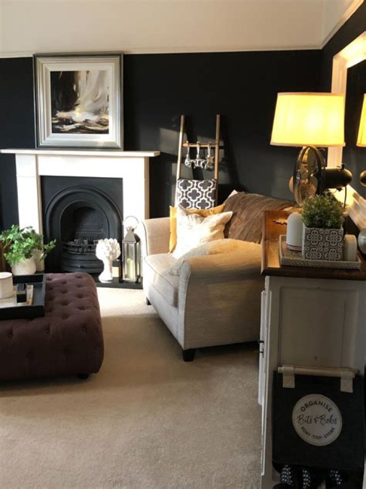 What does a dark wall do to a room?